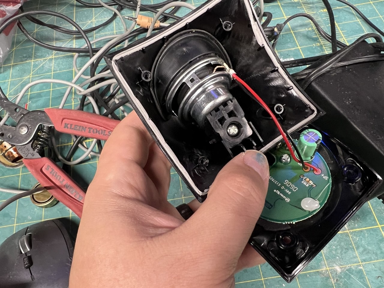 Not only was it a perfect fit sonically and electrically, but also physically! This screwed-in piece of plastic rests against the back of the speaker in the original unit, and it does here as well, so I didn't even need to finagle together a retention mechanism.